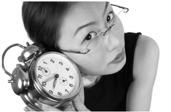 Women holding a clock