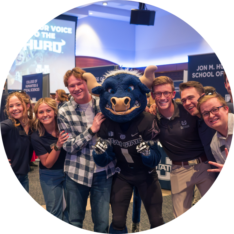 Big Blue with students at USU Open House
