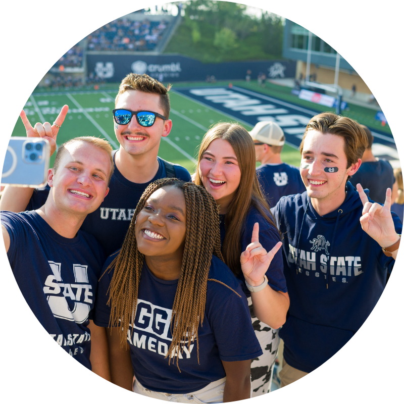 Students taking selfie at USU football game