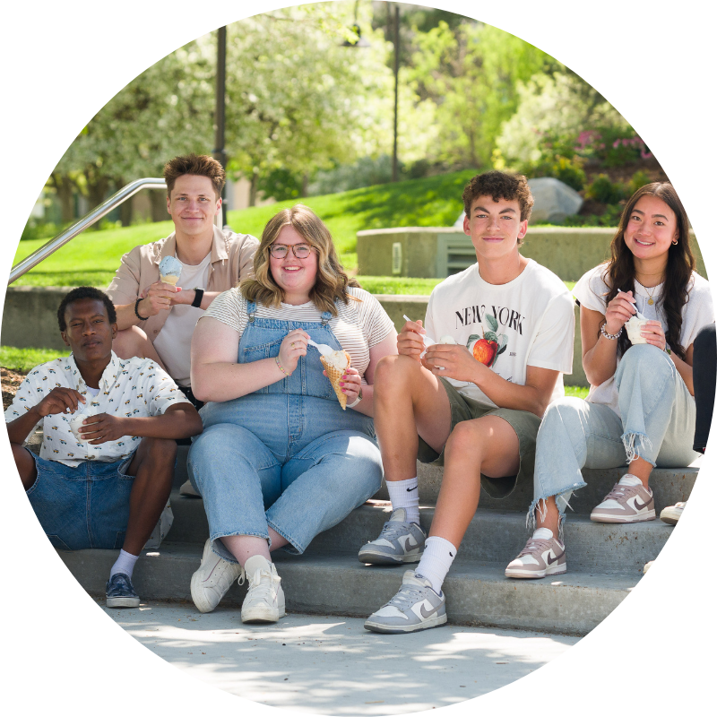 Students sitting eating ice cream