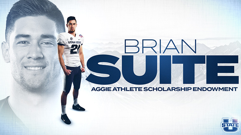 Brian Suite dressed in Aggie Football gear smiling