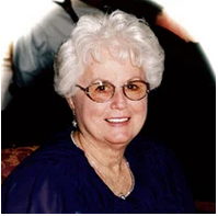 Mildred Ibey wearing glasses and blue shirt