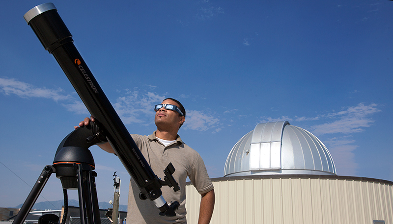Student with a telescope