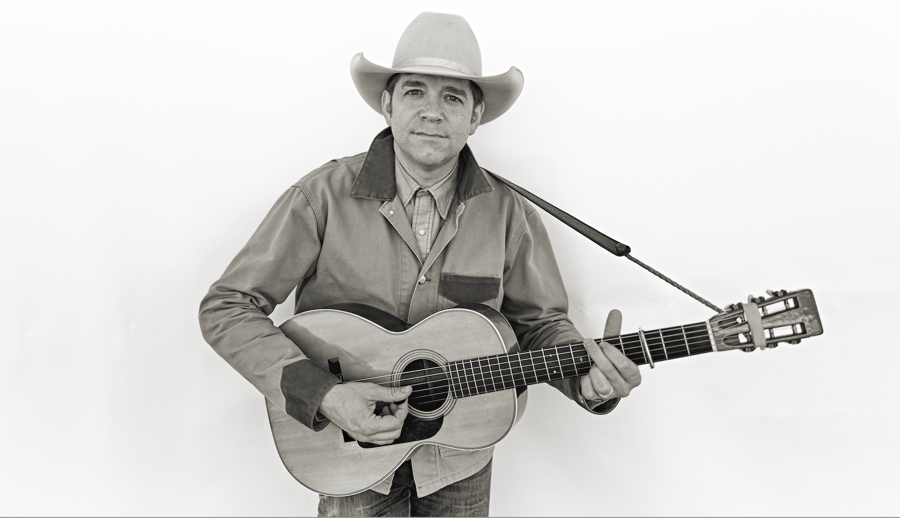 Andy hedges holding a guitar