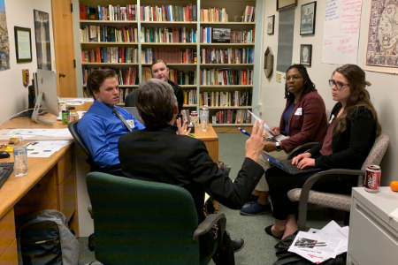 Conny Mayer meets with CAI students during a simulation exercise