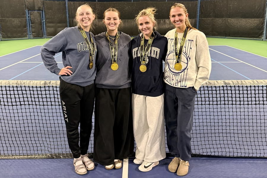 Four girls on tennis court