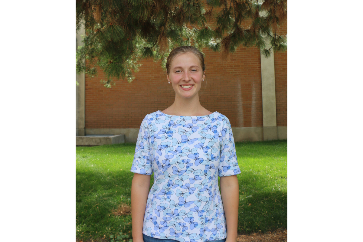 professional headshot of a woman with a floral shirt on