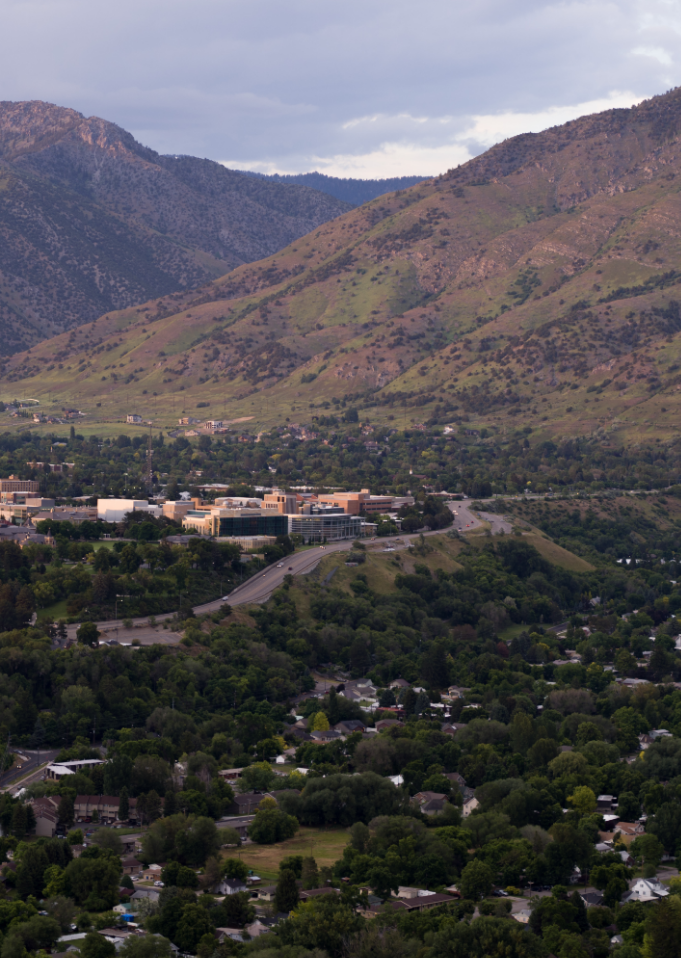 Aerial photo of Utah State University campus at sunset.