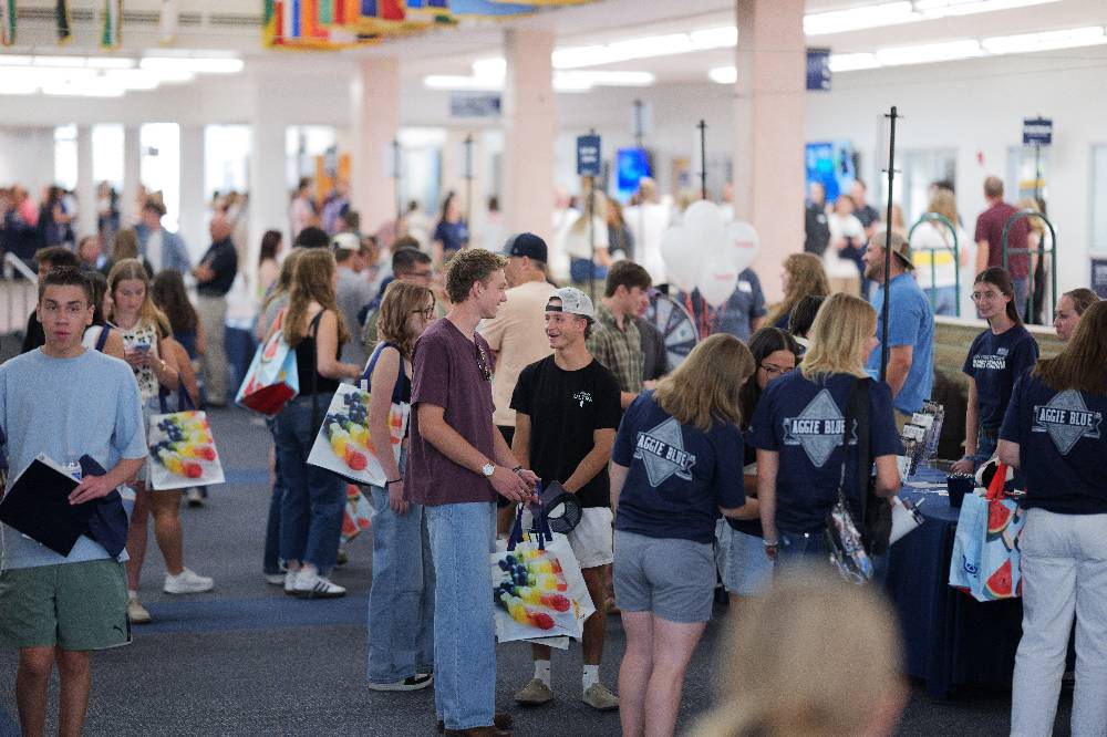 People walking around the Welcome Fair