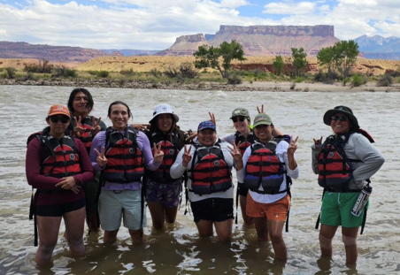 mccann students standing in water in front of butte in southern utah