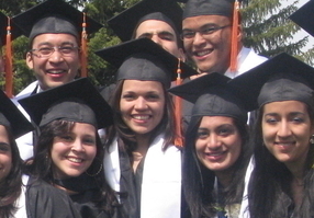 USU alumni in graduation attire