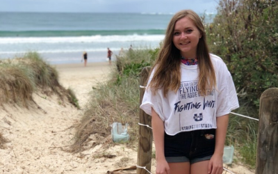 USU Alumnus Kinsey Brashears poses on an Australian beach