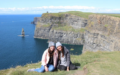 USU Alumnus Kayla Cook poses with another woman on the Cliffs of Moher