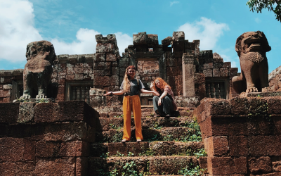 USU Alumnus Camryn Rigby poses on the steps of Cambodian ruins