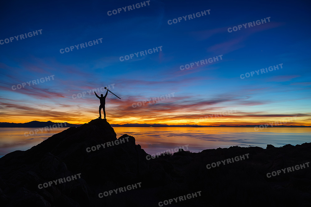 Hiker sunset silhouette on Antelope Island