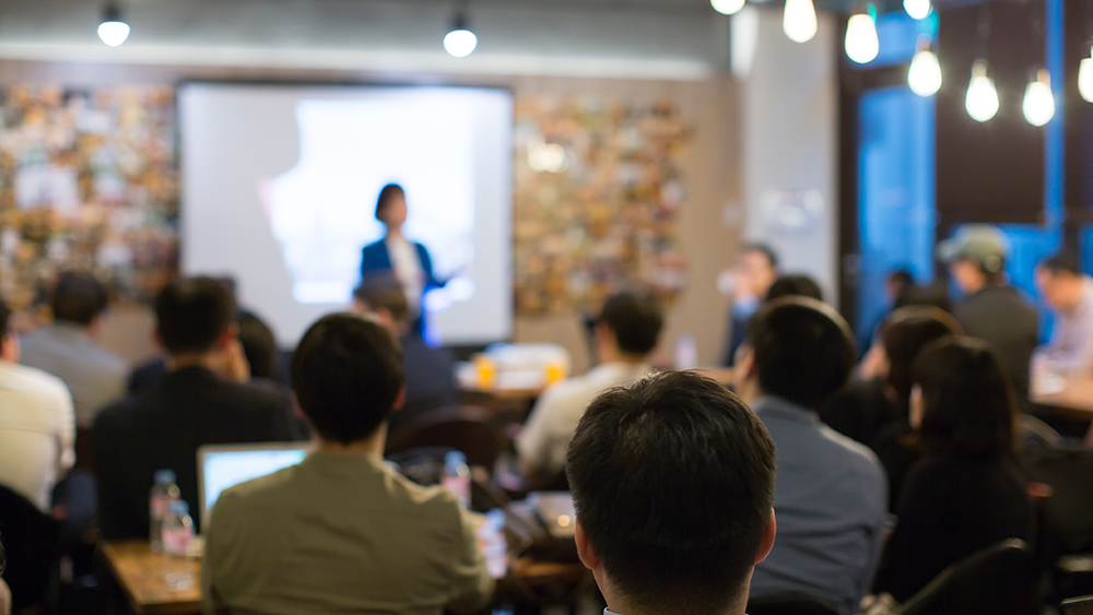 speaker with audience in presentation