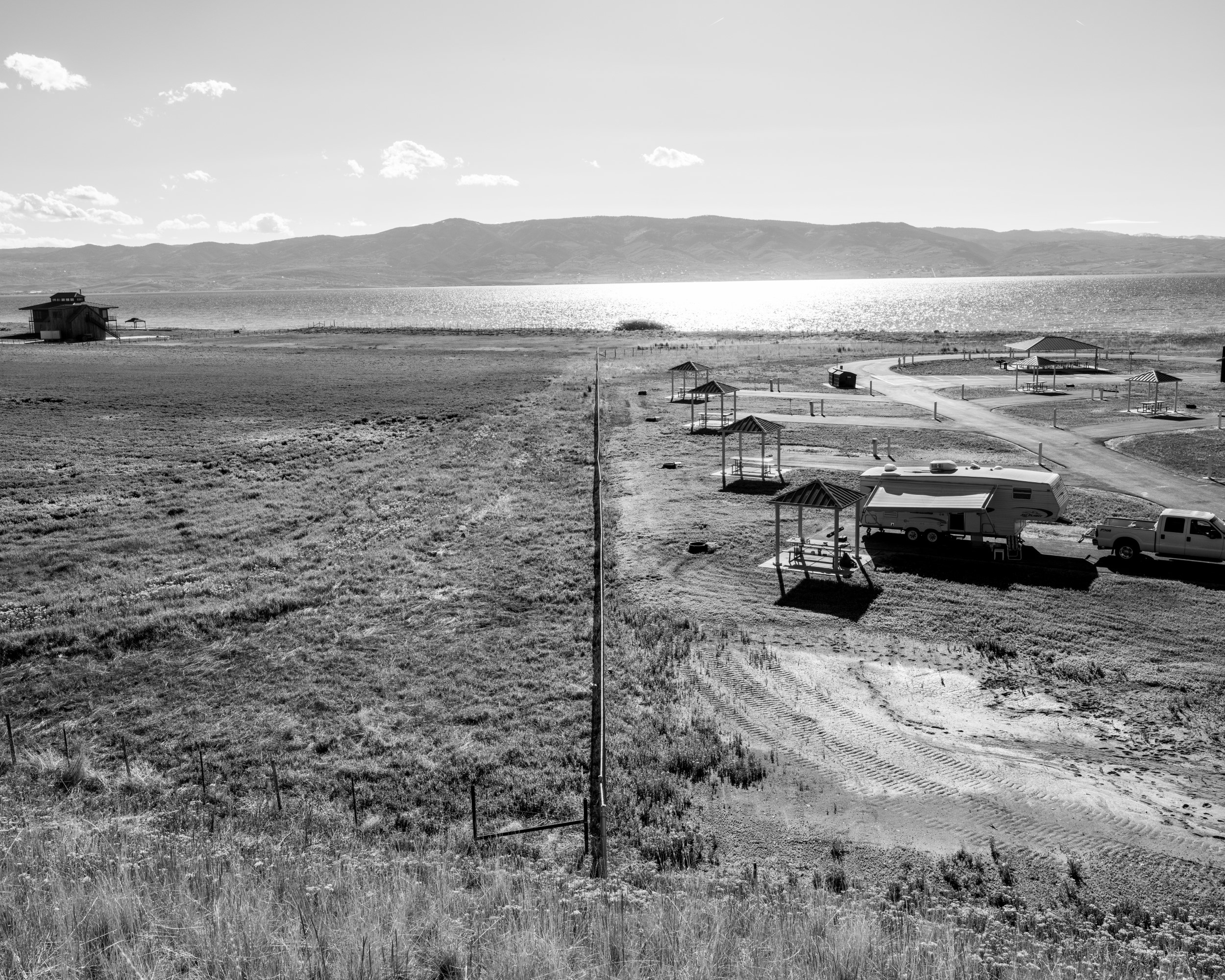 Aerial view of recreational areas next to Bear Lake, all in grayscale.