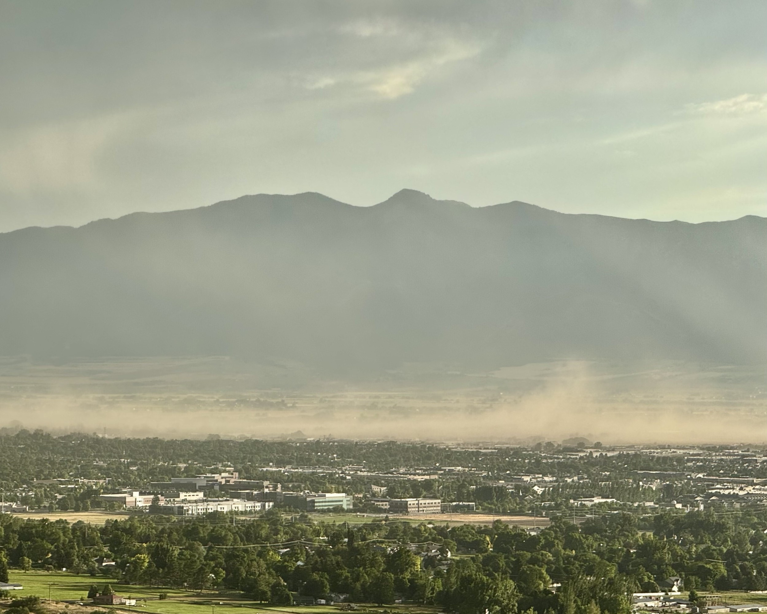 Aerial view of haze settled over a populated valley