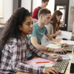 Students sitting at a computer