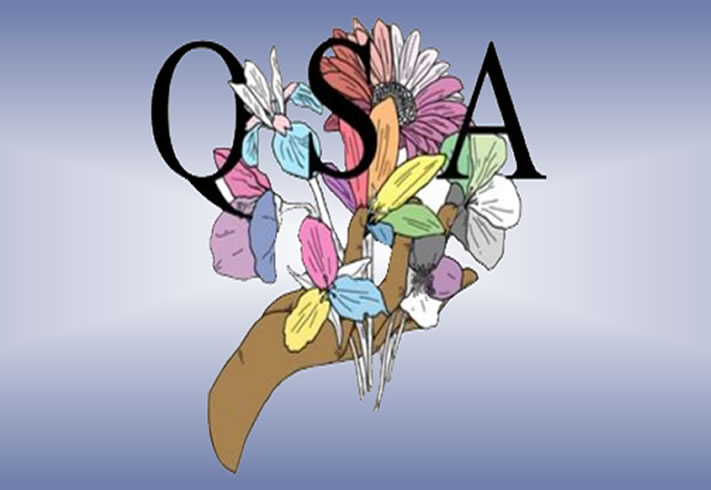 Hand holding flowers with "QSA" at top