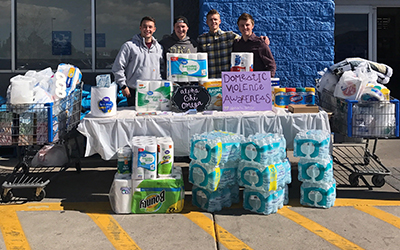 Fraternity members at Utah State University raise funds and awareness for domestic abuse.