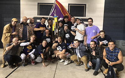 Fraternity members at Utah State University celebrate after winning a flag football tournament.