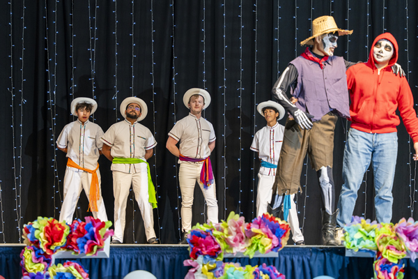 USU Fiestas Américas dancers preforming on stage in costume