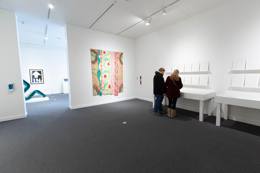 Two people looking into a shadow box table