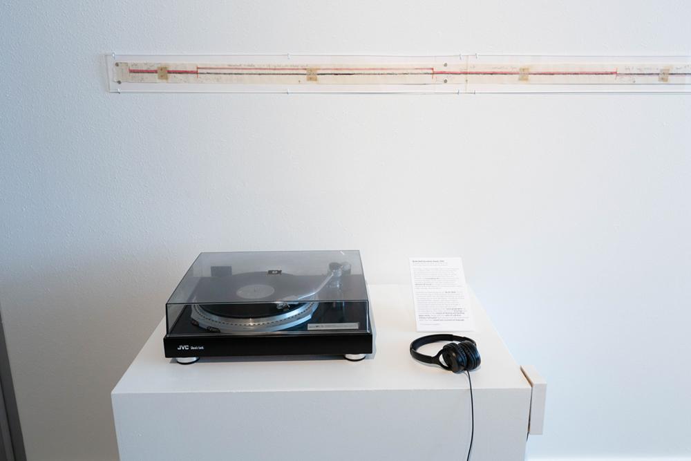 A record player and headphones on a display table