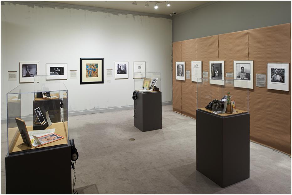 An exhibition space with black display tables