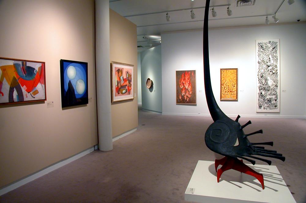 A sculpture in the middle of an exhibition room