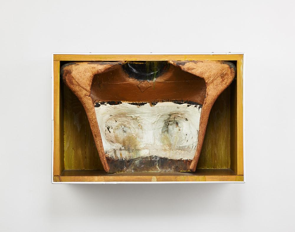 A cast in a wooden box