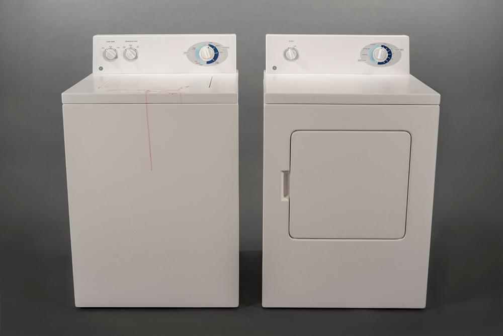 A white washer and dryer machine