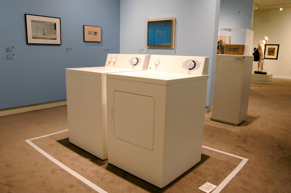 A washer and drying in the middle of a room