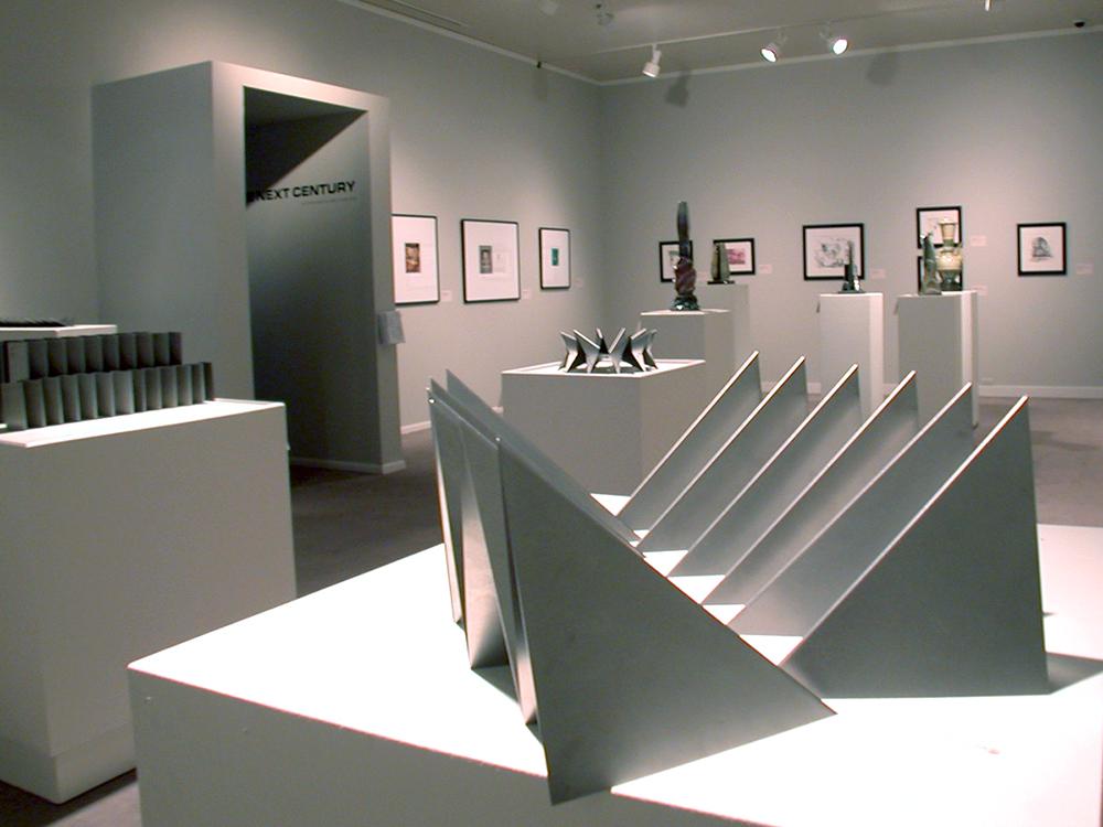 A sculpture of triangle on a white table