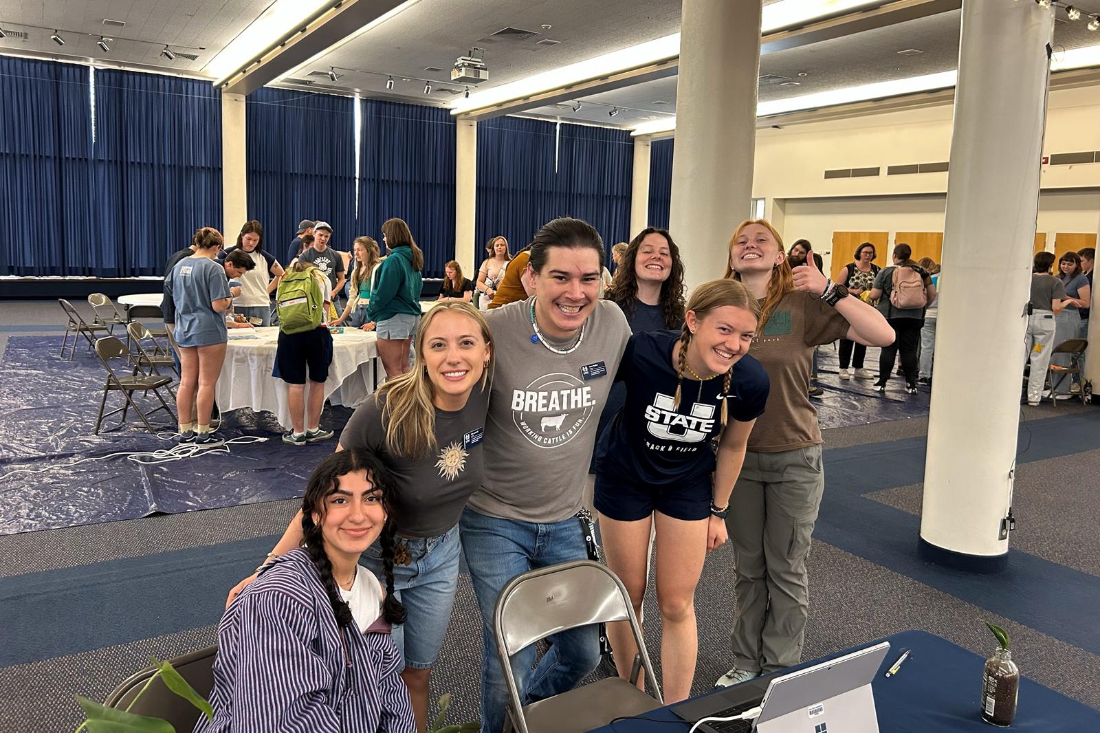 Five members of the Earth Week Committee together smiling.