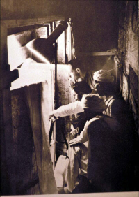 Howard Carter entering Tutankhamun's Tomb (click to see larger image)