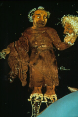 Greek vase depicting an actor holding a mask (click to see larger image)