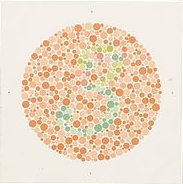 A color vision test image consisting of many small colored circles. The background circles are shades of orange, while green and pink circles form the number “3” in the center.