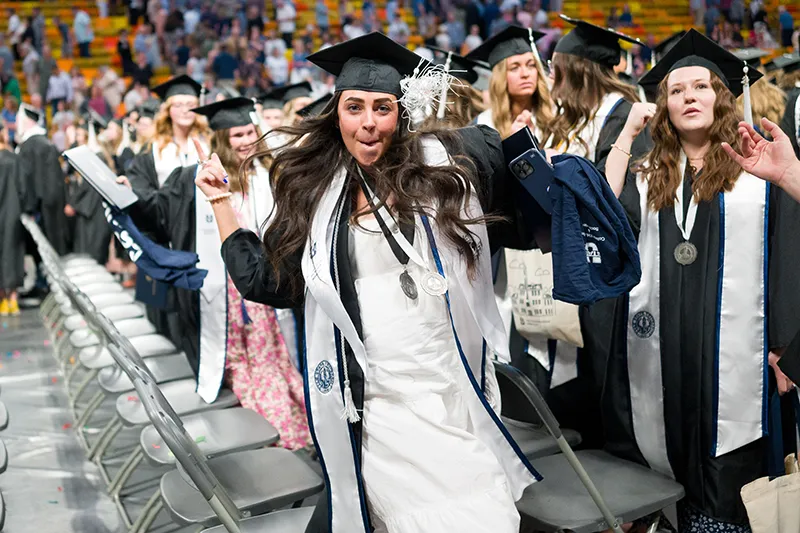 commencement, student about to recieve diploma