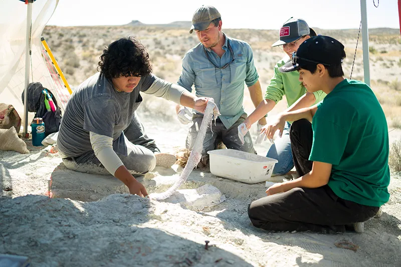students at a dig site