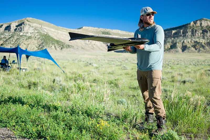 student with a drone