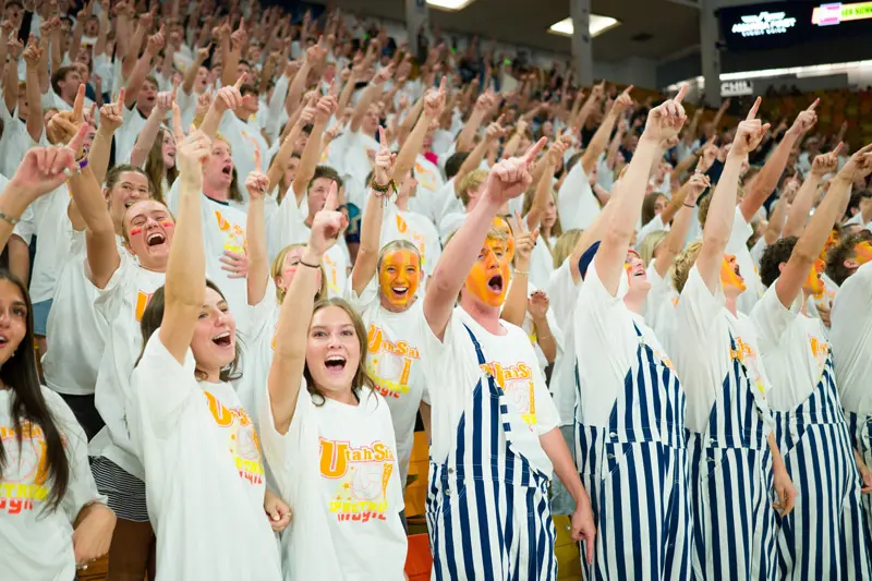 Students chatting during a sporting event