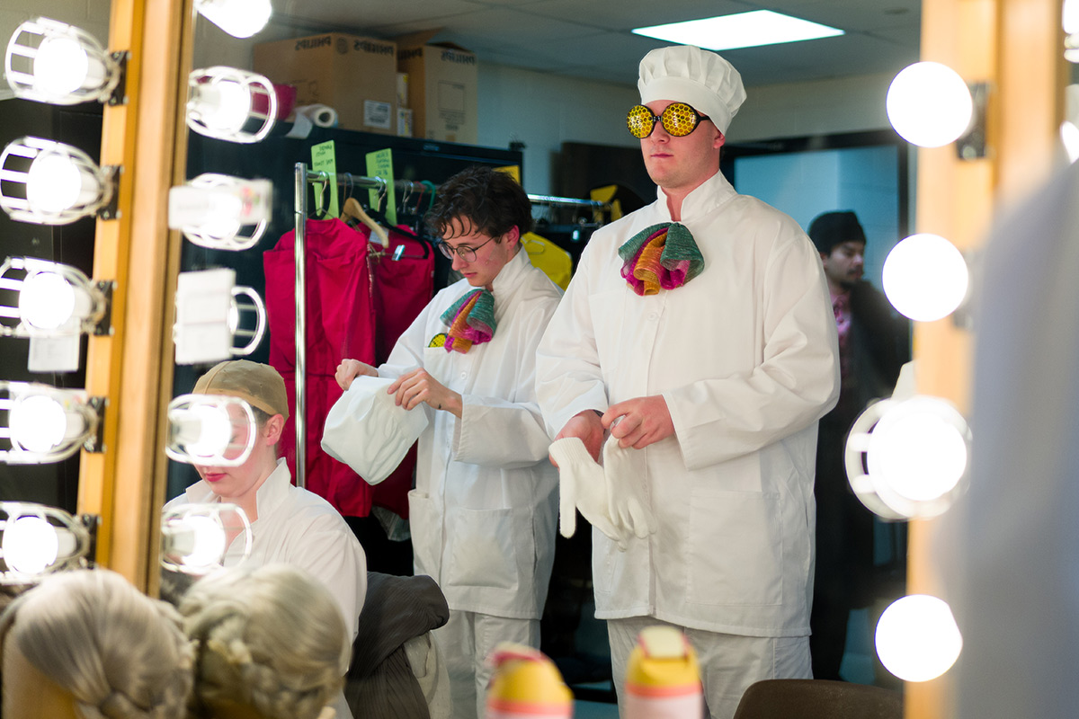Students getting into their costumes before the big show.