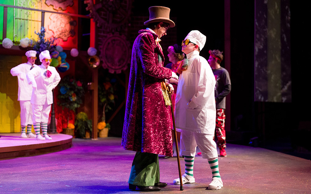 Wonka talking to one of the umpa lumpas