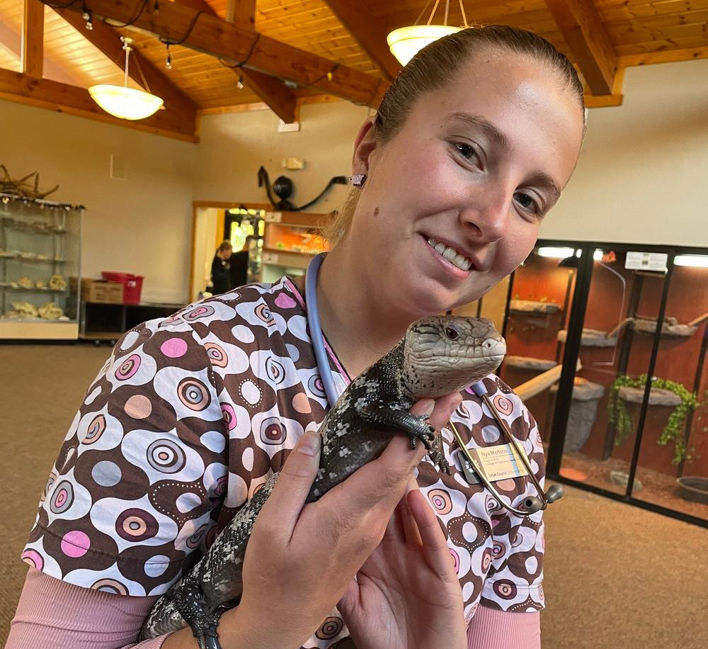 student holding a lizard