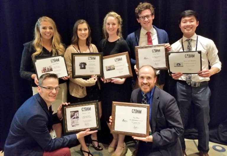 students displaying all nine titles