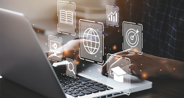 Graphic of laptop with application icons floating out of the screen.