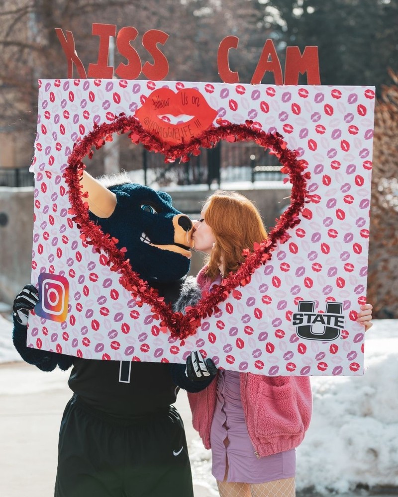 Big Blue gets a kiss from a female student in front of a