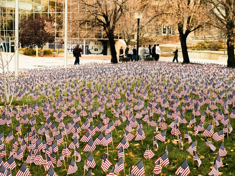 Thousands of mini U.S. flags decorate a lawn outside of the Taggart Student Center
